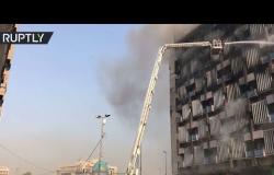 صعود الدخان فوق بناية التأمين الوطنية في بغداد
