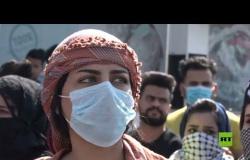 توزيع كمامات في مظاهرات البصرة وسط مخاوف من فيروس كورونا