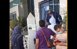 بنوك شارع فيصل تلزم العملاء بإرتداء الكمامة لحمايتهم