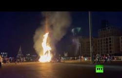 مظاهرات في بيروت وإضرام النار في تمثال قبضة الثورة