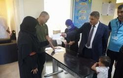 توزيع 700 فيزا كارت علي أسر الشهداء في قرية الروضة بشمال سيناء