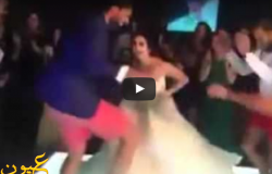  بالفيديو :رقصة جنونية لعروسة مع عريس يرتدي “شورت أحمر”